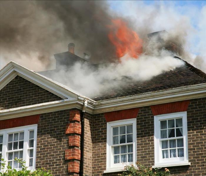 Roof in flames from fire